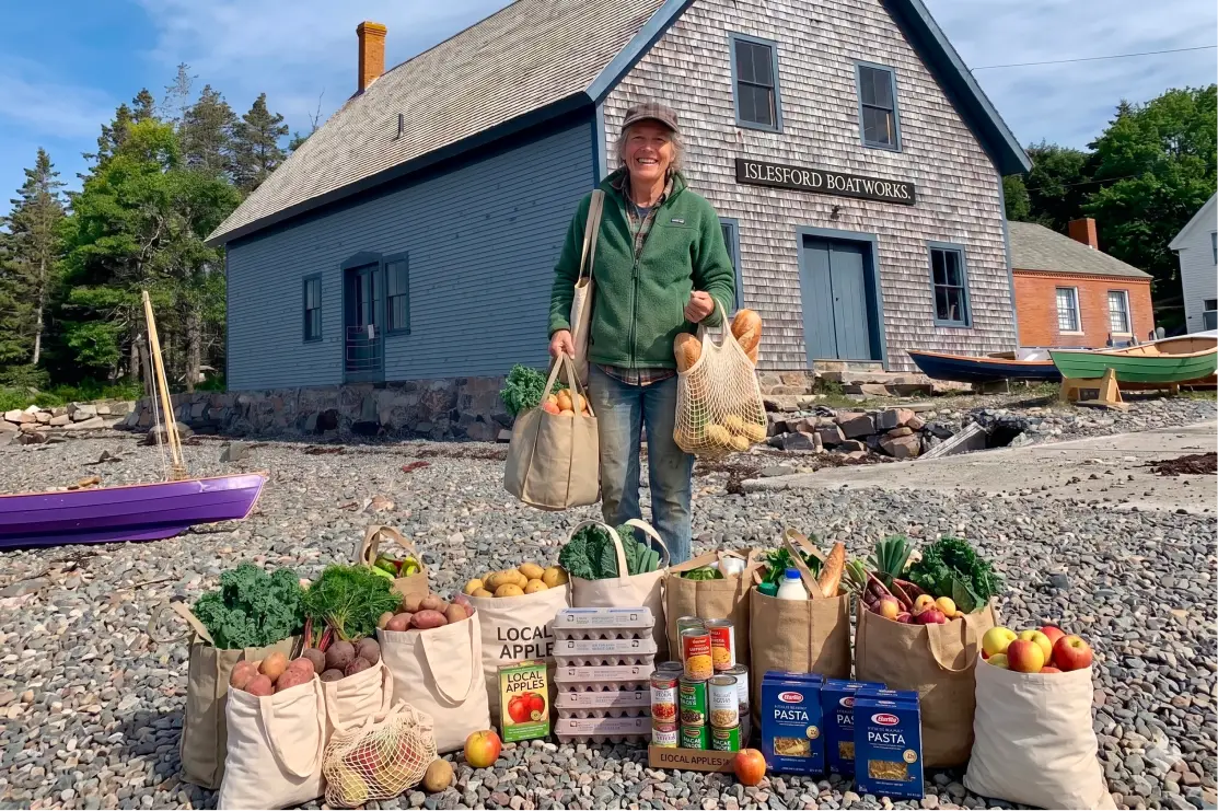 Groceries displayed on the beach outside Islesford Boatworks